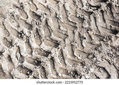 Tyre Mark Background. Tire Track Shape. Trail Lines On Dry Brown Sand Pattern. Road Construction Site Backdrop. Heavy Machinery Imprint. Dried Mud Vehicle Wheel Shape.