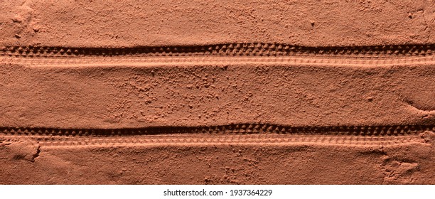 Tyre Pattern On The Reddish-orange Sandy Surface With Copy Space. Imitation Of The Traces Of The Rover On The Planet Mars. Top View, Banner