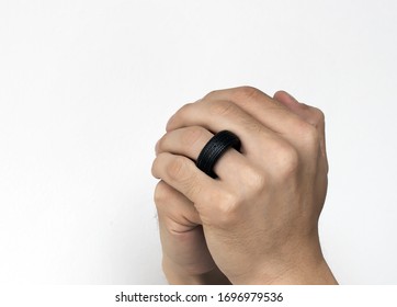 Tyre Ring On Love Finger On White Isolated Background In Concept Care Tired Automotive Service.