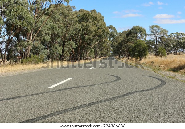 tyre skid marks on a country\
road