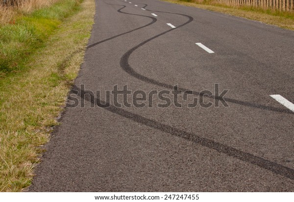 tyre skid marks on a rural\
road