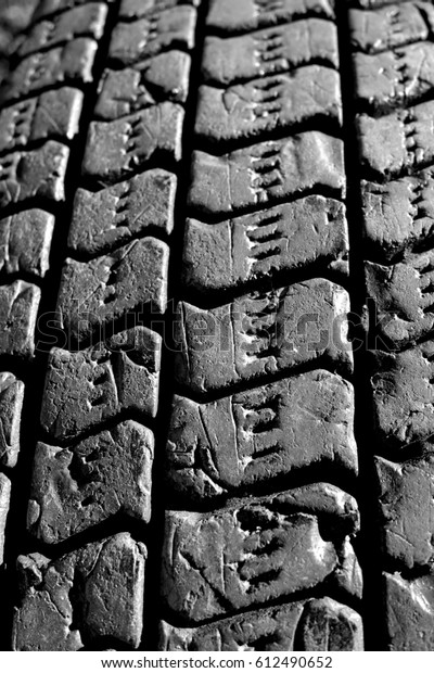 Tyre texture background closeup. Image\
includes a effect the black and white\
tones.