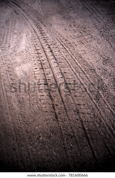 Tyre track on dirt sand or mud, retro\
tone, grunge tone, drive on sand, off road\
track