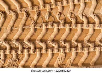 Tyre Tracks On Brown Sand In Construction Site. Abstract Background And Pattern.