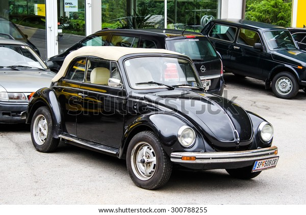 TYROL, AUSTRIA - JULY 29, 2014:
Black retro car Volkswagen Beetle at the used cars trade
center.