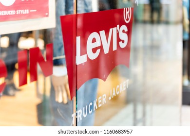 Tysons Corner, USA - January 26, 2018: Closeup Of Levi's, Levis Jeans Denim Store, Shop With Trucker Jacket Sign On Glass Window, Door Entrance With Nobody In Shopping Mall In Virginia