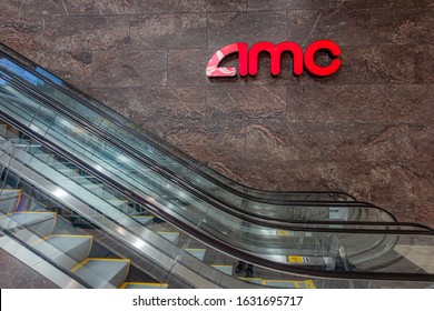 Tysons, Virginia, USA - November, 4, 2019: AMC Theatres Logo Next To Escalators. 