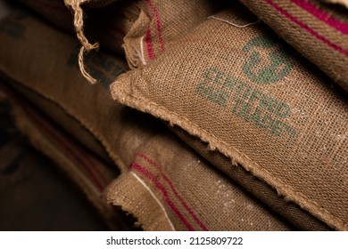 TYUMEN, RUSSIA - FEBRUARY 18, 2022: Bags Of Green Coffee Beans With 