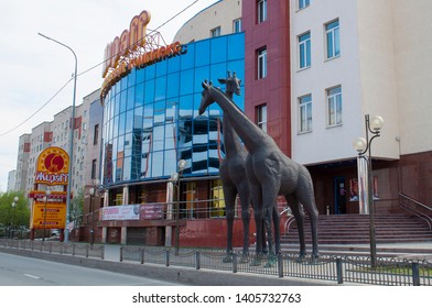 Tyumen, Russia, on May 8, 2019: A sculpture giraffes near an entertainment complex of "Жираff".