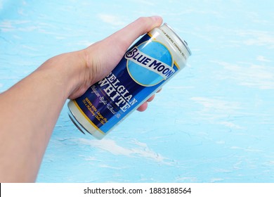 Tyumen, Russia-December 23, 2020: Blue Moon Beer Can. Belgian White Ale From Tenth And Blake Beer Company, Division Of Chicago-based MillerCoors.