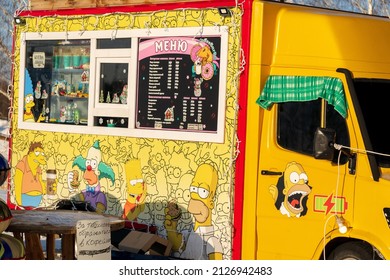 Tyumen, Russia-February 07, 2022: Images Of The Simpsons Homer, Bart On The Car. Cafe In Winter