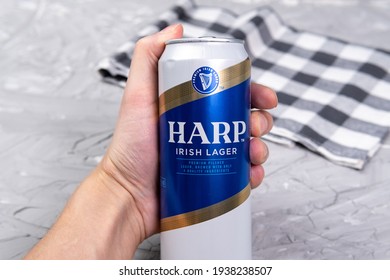 Tyumen, Russia-February 26, 2021: Beer Harp Irish Lager, Metal Can, Logo Close-up