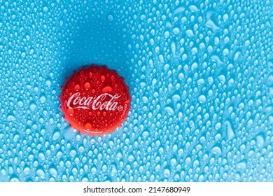 Tyumen, Russia-January 19, 2022: Coca Cola cap logo close up with water drops. Selective focus