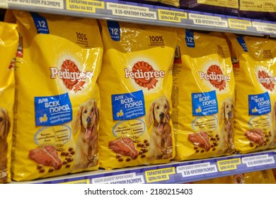 Tyumen, Russia-June 30, 2022: Dog food products of Pedigree Petfoods, selective focus. Buying goods in the supermarket