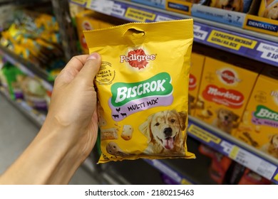 Tyumen, Russia-June 30, 2022: Pedigree biscrok Petfoods dog food, selective focus. Buying goods in the supermarket