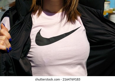 Tyumen, Russia-June 4, 2022: Nike Logo Is A Close-up On A Woman T-shirt. Nike Is A Global Retailer Of Sportswear And Running Shoes