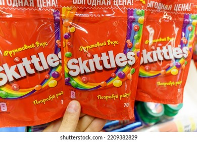 Tyumen, Russia-September 27, 2022: Colorful And Tasty Sweet Skittles And Candy Surrounding The Bag. Sell In Supermarket