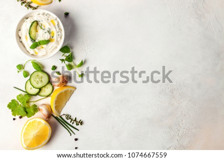 Similar – Tzatziki and pita bread on marble