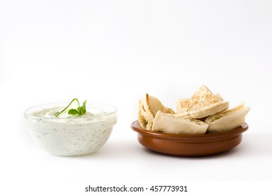 Tzatziki Sauce In Bowl And Pita Bread Isolated On White Background

