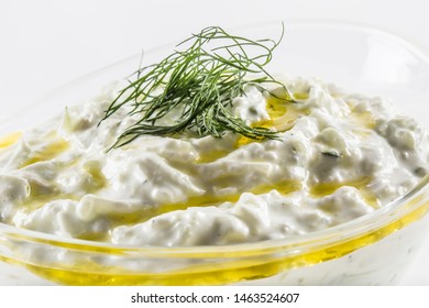 Tzatziki Sauce In A Glass Bowl Isolated On White Background.