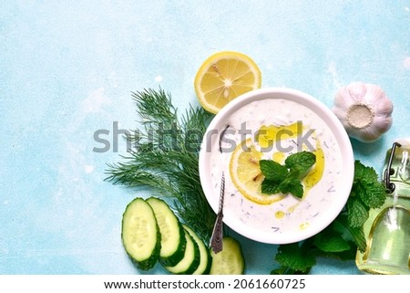 Similar – Tzatziki and pita bread on marble