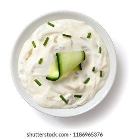 Tzatziki In White Ceramic Bowl Isolated On White From Above. Slice Of Cucumber And Chopped Chives.