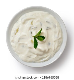 Tzatziki In White Ceramic Bowl Isolated On White From Above. Mint Leaf Garnish.