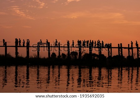 U Bein wooden bridge, world’s longest teak footbridge, crossing Taungthaman Lake, Amarapura, Mandalay, Myanmar, (Burma)