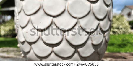 u shaped feather statue pattern from owl sculpure