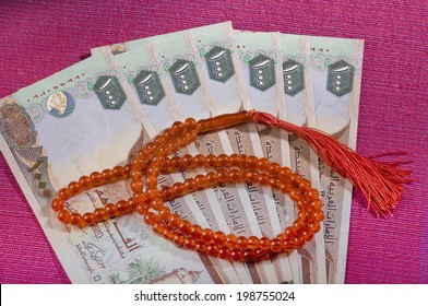 UAE Dirham Currency Notes And A Rosary - Sharia Finance Objects