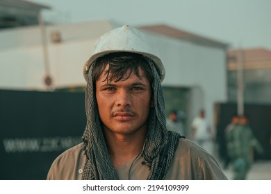 UAE Dubai - Feb 18, 2022: Confident Construction Worker Or Labour Looking Camera At Workplace - Concept Of Daily Wagers Lifestyle And Happi