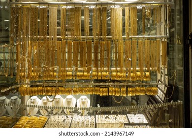 UAE, Dubai.29.03.2022. Showcases Of The Gold Market. Products From Pure Gold Of Arab Masters. Traditional Jewelry On The Counter. The Sparkle Of Emirates Luxury.