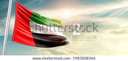 UAE national flag waving in beautiful sunlight.