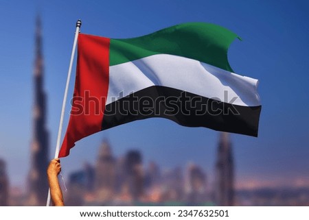 UAE United Arab Emirates
waving flag in hand