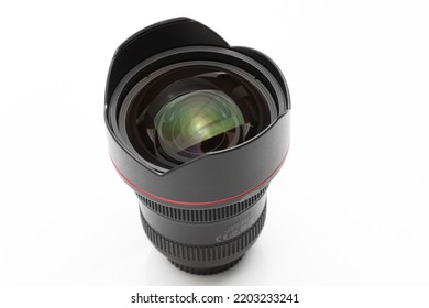 UAE,Dubai -September,18,2022 -canon 11-24mm F-4L USM  Canon EF Mount Lens Isolated On A White Surface And With Canon Lens At The Background - Image  