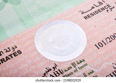 UAE's residence Visa stamp on a passport - Shutterstock ID 2198032929