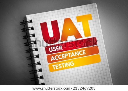 UAT - User Acceptance Testing acronym on notepad, technology concept background