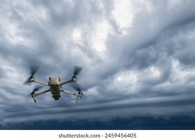 UAV drone copter flying with digital camera.Drone with high resolution digital camera. Flying camera take a photo and video.The drone with professional camera takes pictures of the rain storm on sea - Powered by Shutterstock