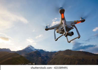 uav drone copter flying with digital camera - Shutterstock ID 421589491