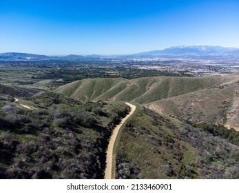 A UAV Drone View of A Mountain Trail in the California Hills in Spring Near Yucaipa, California, After a Wet Winter Sprouted Green Grass