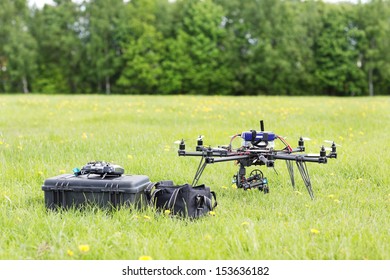 UAV Helicopter With Toolbox And Bag In Park