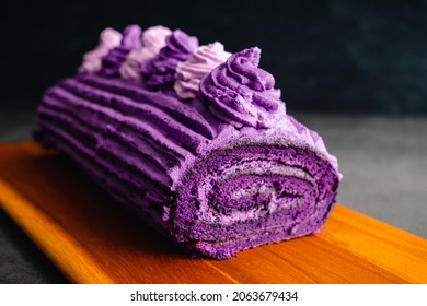 Ube Cake Roll with Whipped Cream Frosting: Roulade made with purple sweet potatoes and whipped cream icing