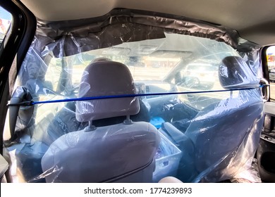 Uber Driver Uses Plastic Cover Inside His Car To Protect Himself Against COVID-19. Brooklyn, New York, USA May 1, 2020.