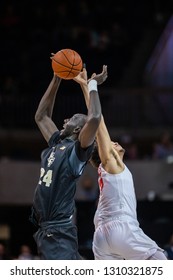 UCF Tacko Fall (24) And SMU Ethan Chargois (25) At Tip-off During A NCAA Basketball Game Between The UCF Knights Vs SMU Mustangs February 10, 2019, At Moody Coliseum, Dallas, Texas.