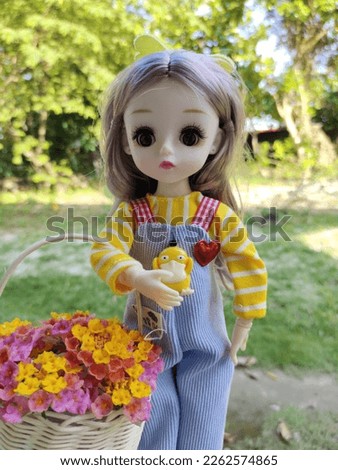 uci Barbie picking beautiful lamtana flowers in the yard