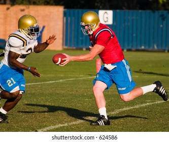 UCLA Bruins Football Practicing.  QB Handoff