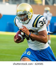 UCLA Bruins Football Team Practicing.  Linebacker With Ball - Mark Cordell