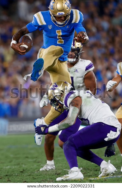 UCLA Quarterback Dorian Thompson-Robinson (1) Leaps Over Washington ...