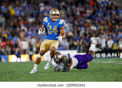 UCLA Running Back Zach Charbonnet (24) Escapes A Tackle-attempt By Washington Linebacker Alphonzo Tuputala (11) During An NCAA College Football Game Friday, Sept. 30, 2022, In Pasadena, Calif. 