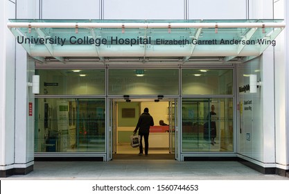 UCLH London College Hospital. Glass Door Entrance With Man Walking  Into Maternity, Gynaecology And Neonatal Wards With A Black Sign Above - University College Hospital Elizabeth Garett Anderson Wing.